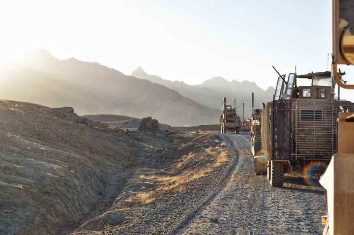 Military vehicles on a mountainous dirt road