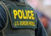 "Police U.S. Border Patrol uniform close-up."