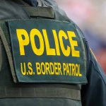 "Police U.S. Border Patrol uniform close-up."