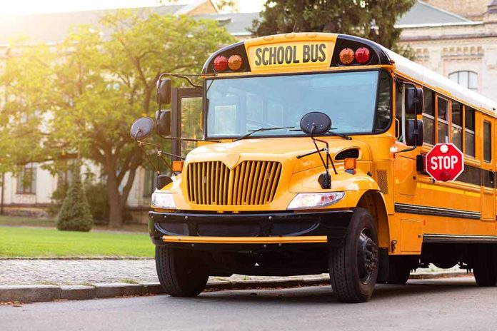 Yellow school bus with extended stop sign.