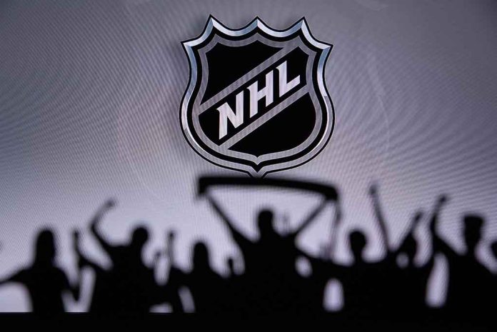 NHL logo with cheering crowd silhouette in foreground