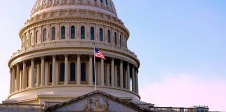 US Capitol building with American flag flying