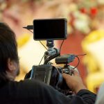 man with mobile phone camera setup