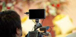 man with mobile phone camera setup