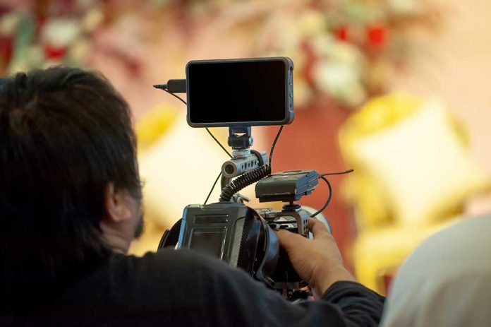1845138022 featured image man with mobile phone camera setup