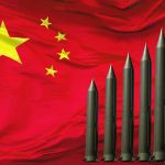 Missiles arranged in height order from left to right in front of Chinese flag