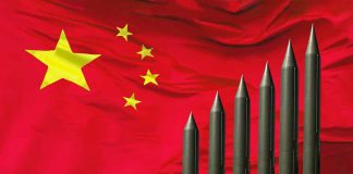 Missiles arranged in height order from left to right in front of Chinese flag