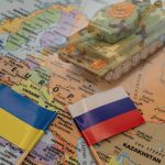 Tank on map with Ukraine and Russia flags