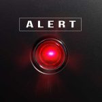 Red alert button on black background