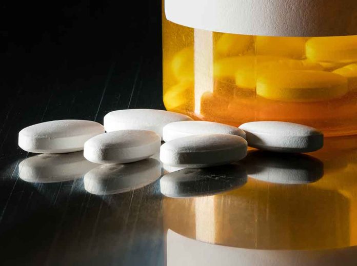 599929199 featured image White pills beside an orange pill bottle.