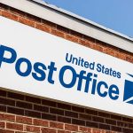 United States Post Office sign on brick building