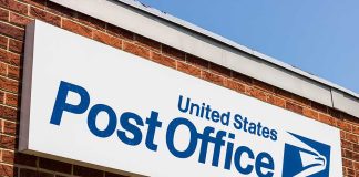 United States Post Office sign on brick building
