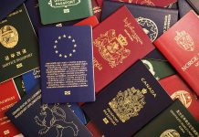 Various colorful international passports spread out
