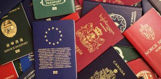 Various colorful international passports spread out