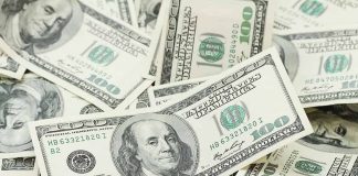 Pile of one hundred dollar bills