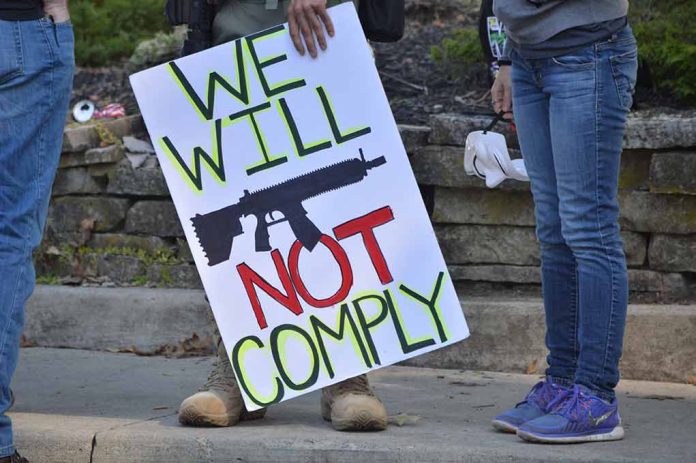 1535700824 featured image Protest sign reads We Will Not Comply