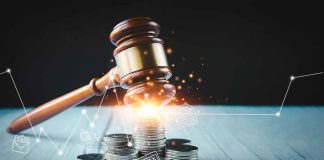 Gavel, coins, and tax icons on a table