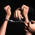 Handling handcuffs and unlocking with a key