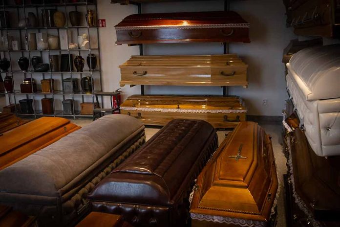 2183836499 featured image Wooden coffins and urns displayed in a showroom