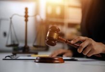 Gavel being struck near scales of justice