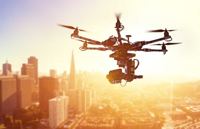 415195669 featured image Drone flying over city at sunset time