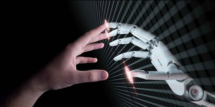 650850907 featured image Human and robotic hand reaching out to touch