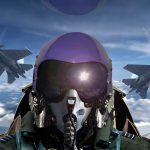Pilot in cockpit with two fighter jets outside