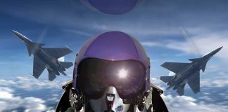 Pilot in cockpit with two fighter jets outside