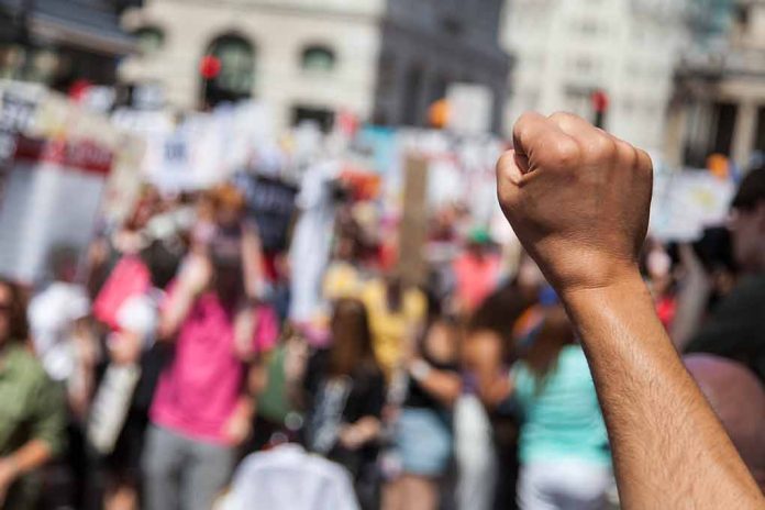 1135501646 featured image Raised fist in front of a crowd