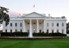 The White House with fountain and American flag