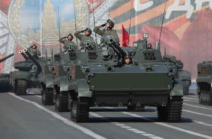 1702004938 featured image Tanks with military personnel in street parade formation