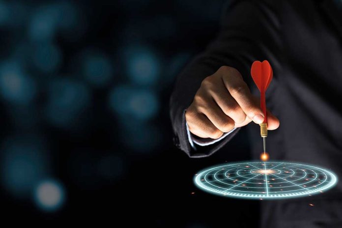 1722840469 featured image Hand aiming dart at digital target.