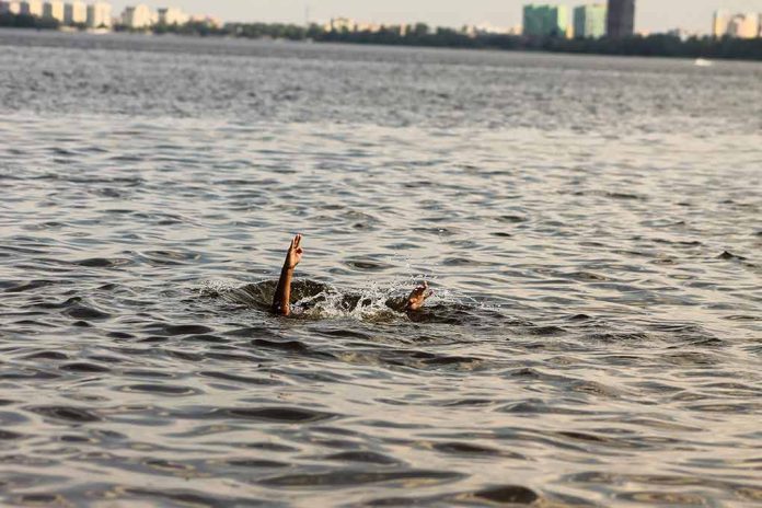 1828334342 featured image Person hand reaching out from the water