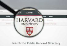 Magnifying glass over Harvard University webpage text and logo