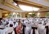 Elegant banquet hall set for a formal event.