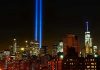 New York City skyline at night with memorial lights