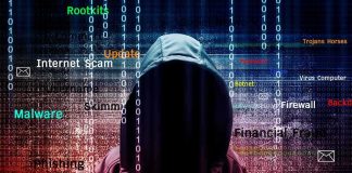 Hooded figure with cybersecurity terms and binary code background