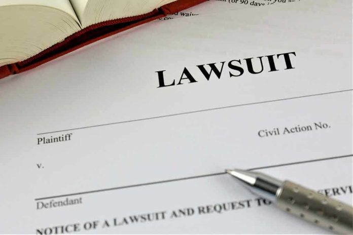 775826128 Lawsuit document with a pen and book