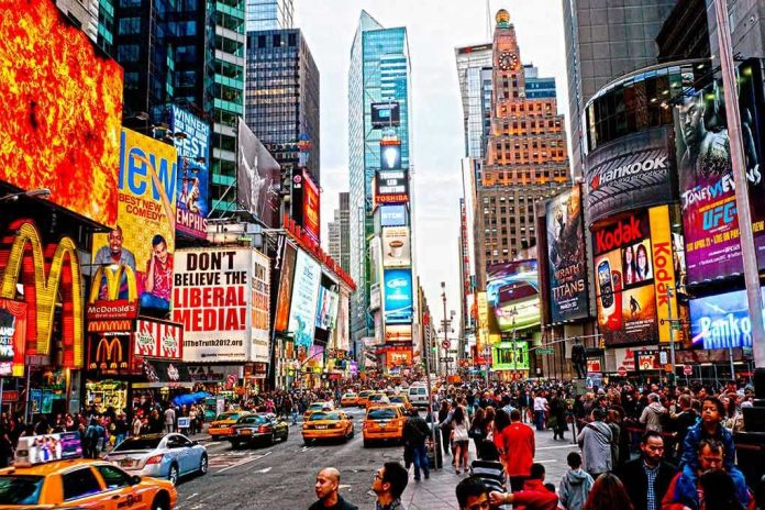 99855551 Times Square crowded with people and bright electronic advertisements