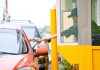 Customer receiving a food order at a drive thru window
