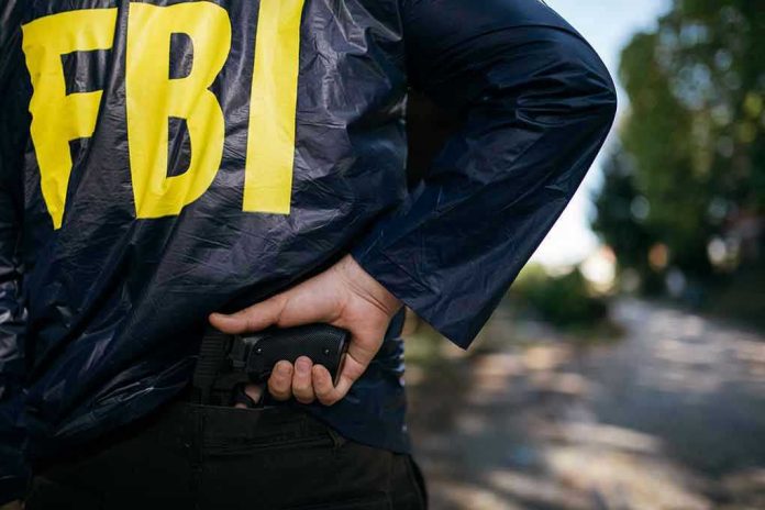 624106589 FBI agent holding a gun behind the back