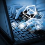 Hands typing on a laptop keyboard with floating email icons
