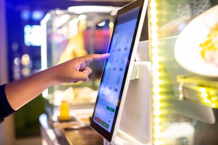 shutterstock_2374938925.jpg A hand interacting with a touchscreen menu in a restaurant