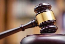 Judges gavel striking a sound block.
