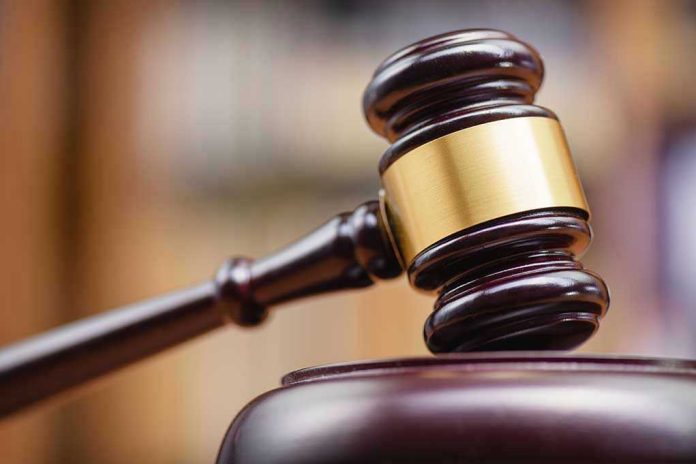 1334292137 Judges gavel striking a sound block.