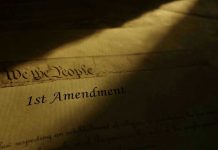 1st Amendment document in dramatic lighting.