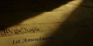 1st Amendment document in dramatic lighting.