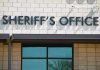Sheriffs Office sign on brick building faade.