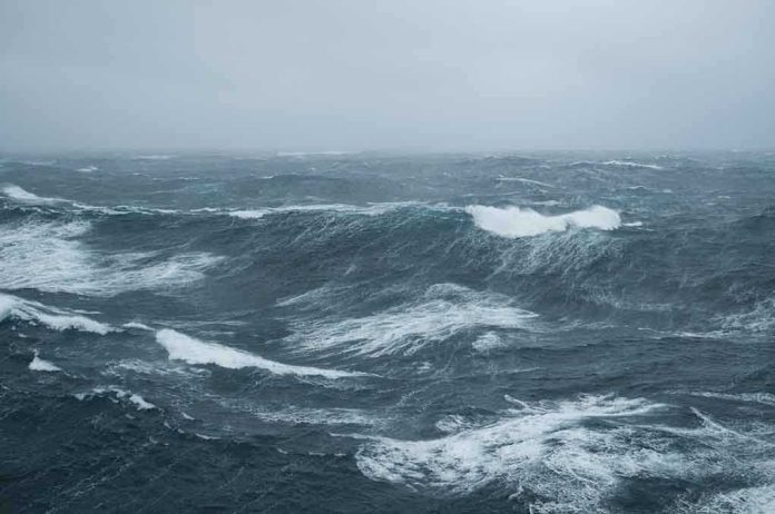 Rough ocean waves under a cloudy sky