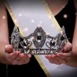 Museum HEIST Stuns Nation — Crown Jewels VANISHED Sash-wearing person holding an ornate jeweled crown.